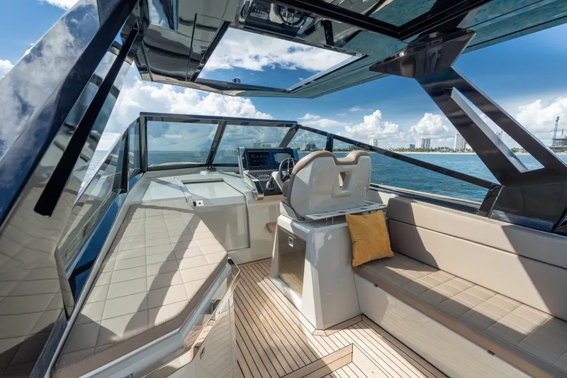 Slide: The Image of 2023 Evo Yachts R4 WA interior with modern seating and panoramic ocean view. - 46