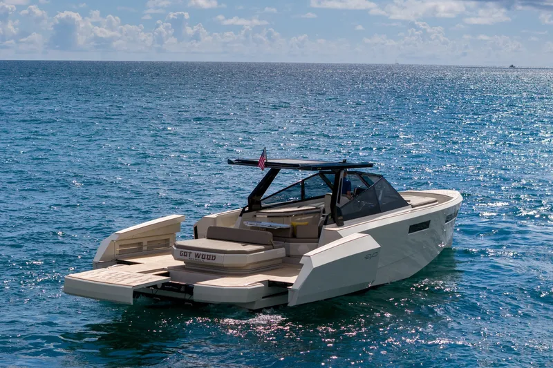 Slide: The Image of 2023 Evo Yachts R4 WA cruising on open sea under clear skies. - 13