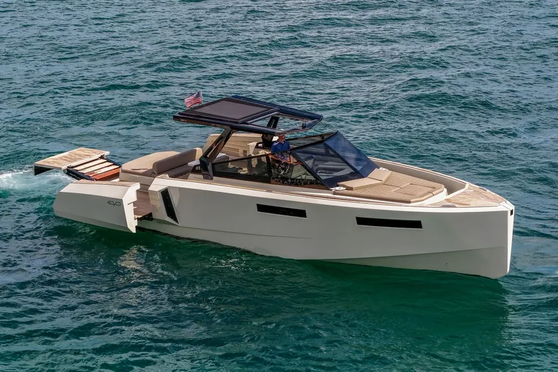 Slide: The Image of 2023 Evo Yachts R4 WA cruising on open water, showcasing sleek design and luxury features. - 15