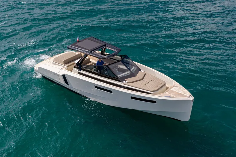 Slide: The Image of 2023 Evo Yachts R4 WA cruising on clear blue water. - 6