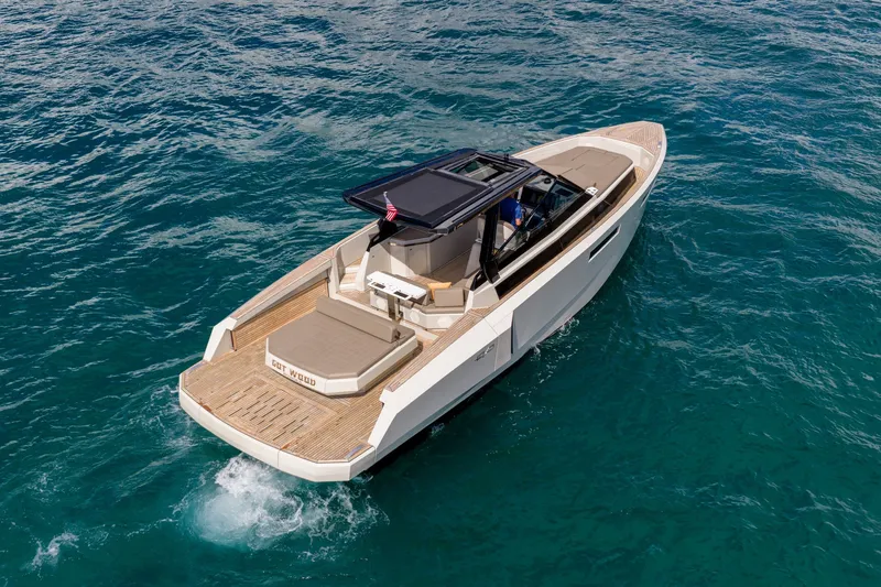 Slide: The Image of 2023 Evo Yachts R4 WA cruising on clear blue water. - 7