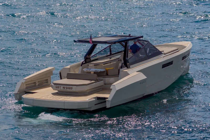 Slide: The Image of 2023 Evo Yachts R4 WA cruising on open water, showcasing sleek design and luxury features. - 8
