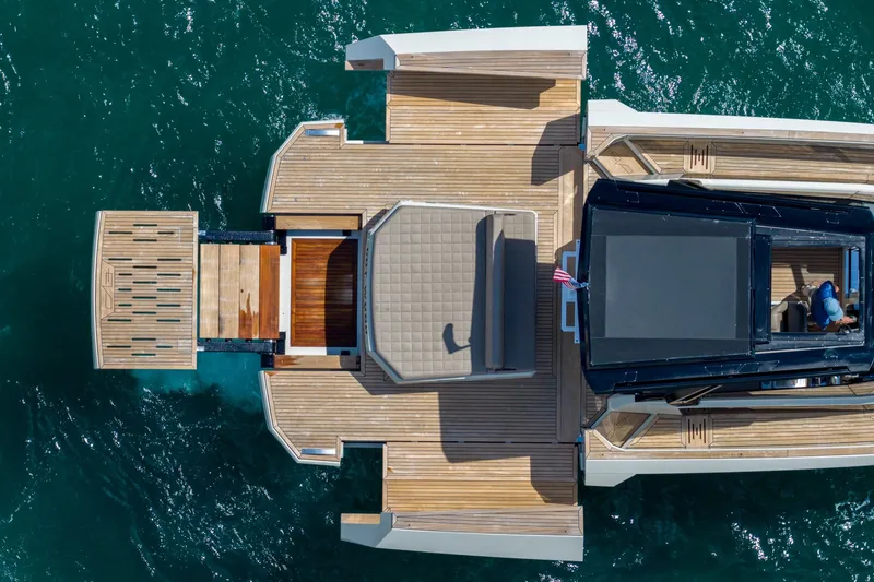 Slide: The Image of Aerial view of 2023 Evo Yachts R4 WA luxury yacht on blue water. - 17