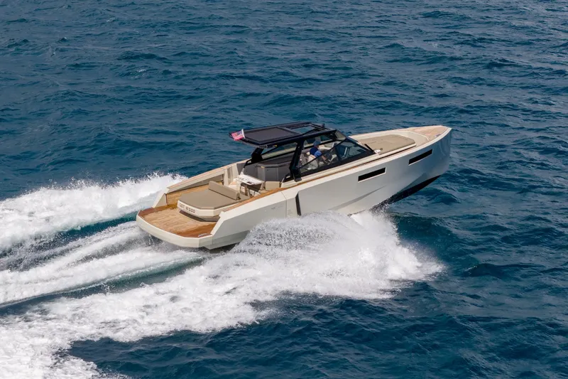 Slide: The Image of 2023 Evo Yachts R4 WA cruising on open sea, showcasing sleek design and performance. - 25