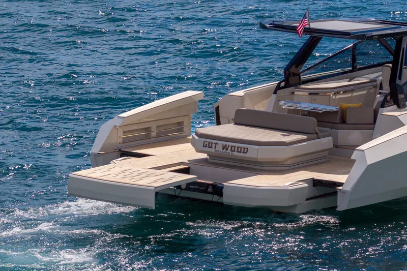 Slide: The Image of 2023 Evo Yachts R4 WA luxury yacht on open water, featuring spacious deck and modern design. - 14