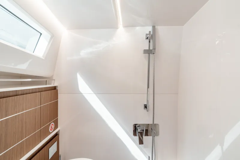 Slide: The Image of Modern bathroom interior on 2023 Evo Yachts R4 WA, featuring sleek shower design. - 31