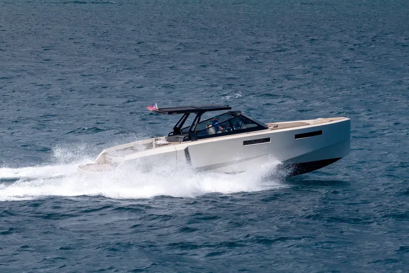Slide: The Image of 2023 Evo Yachts R4 WA cruising on open water, showcasing sleek design and performance. - 24