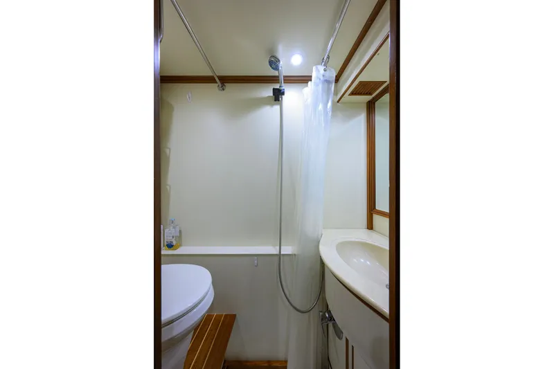 Slide: The Image of Compact bathroom in 2008 Grand Banks 72 Aleutian RP yacht with shower and sink. - 44
