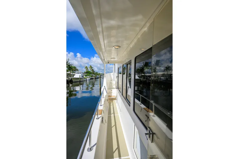 Slide: The Image of Side deck view of 2008 Grand Banks 72 Aleutian RP yacht, reflecting marina scenery. - 33