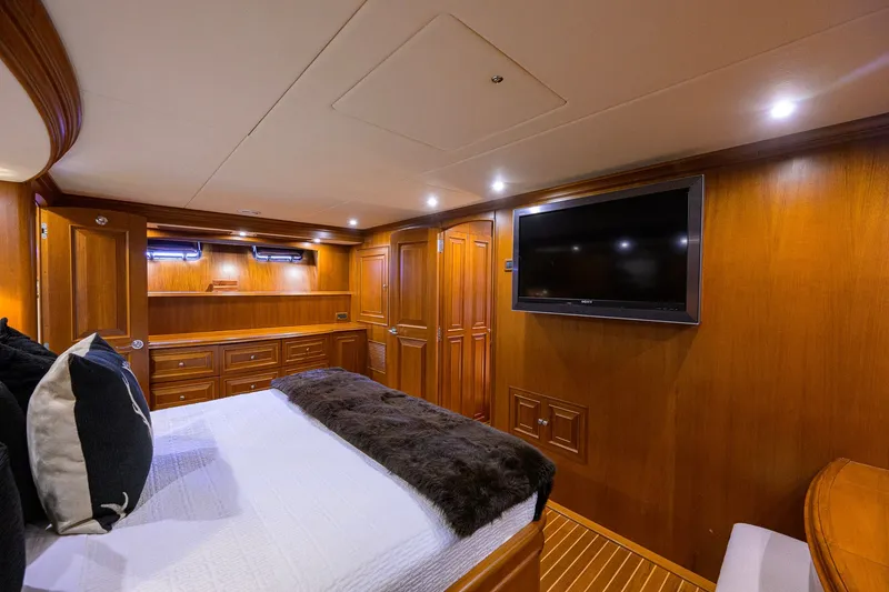 Slide: The Image of Luxurious 2008 Grand Banks 72 Aleutian RP yacht cabin with wood paneling and modern amenities. - 17