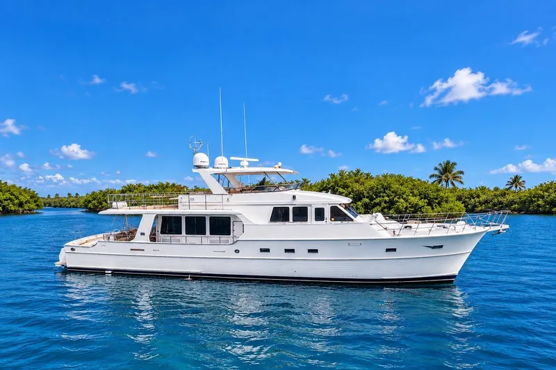 The Image of 2008 Grand Banks 72 Aleutian RP yacht cruising in tropical waters under a clear blue sky. - 0