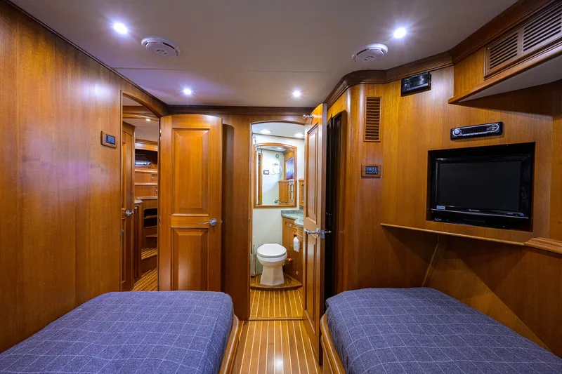 Slide: The Image of Luxurious 2008 Grand Banks 72 Aleutian RP yacht cabin with twin beds and ensuite bathroom. - 25