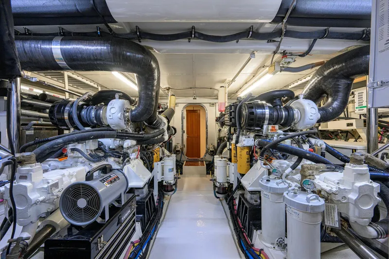 Slide: The Image of Engine room of 2008 Grand Banks 72 Aleutian RP yacht, showcasing complex machinery and piping. - 46