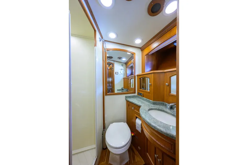 Slide: The Image of Luxurious 2008 Grand Banks 72 Aleutian RP yacht bathroom with wood cabinetry and modern fixtures. - 26