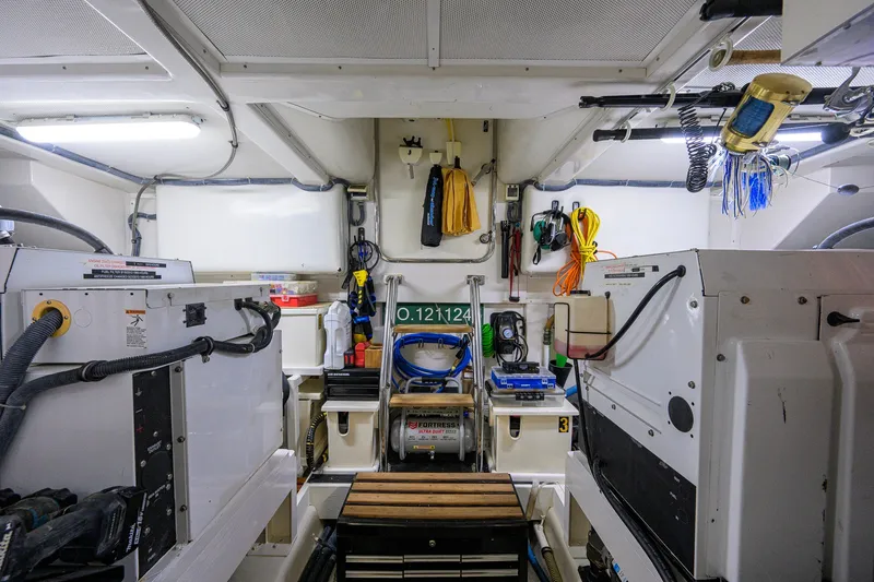 Slide: The Image of Engine room of 2008 Grand Banks 72 Aleutian RP yacht, featuring organized equipment and tools. - 50