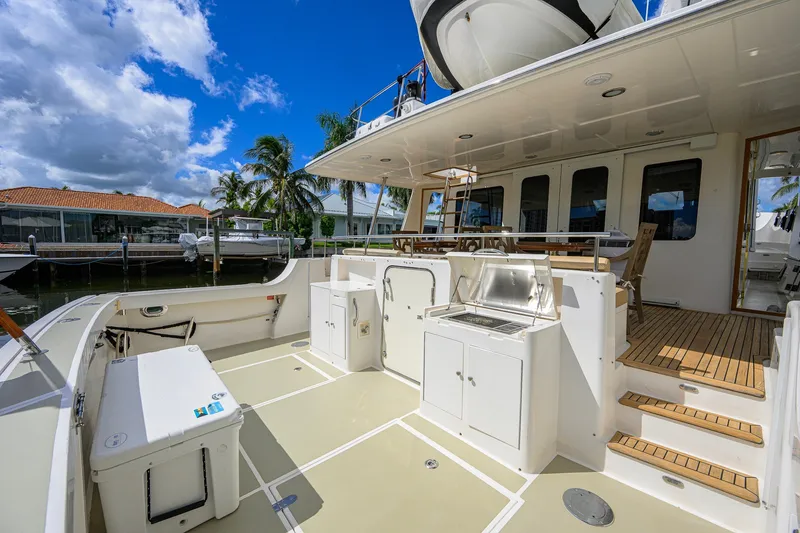 Slide: The Image of 2008 Grand Banks 72 Aleutian RP yacht deck with outdoor kitchen and seating area. - 29