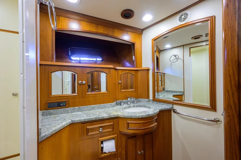 Slide: The Image of Luxurious bathroom interior of 2008 Grand Banks 72 Aleutian RP yacht with wooden cabinetry. - 23