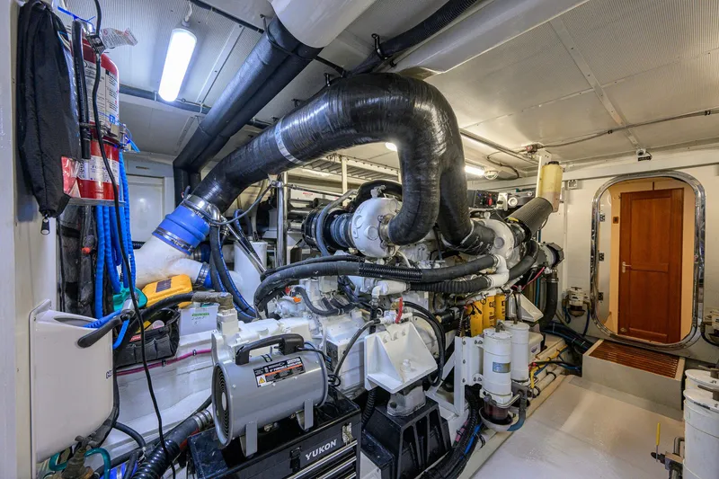 Slide: The Image of Engine room of 2008 Grand Banks 72 Aleutian RP yacht, featuring complex machinery and equipment. - 48