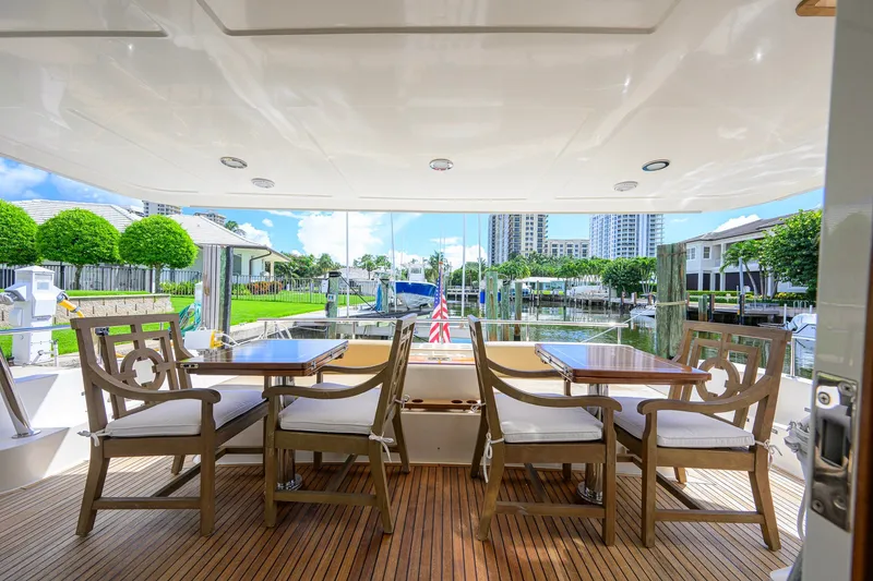 Slide: The Image of Luxury outdoor seating on 2008 Grand Banks 72 Aleutian RP yacht, docked with scenic marina view. - 30