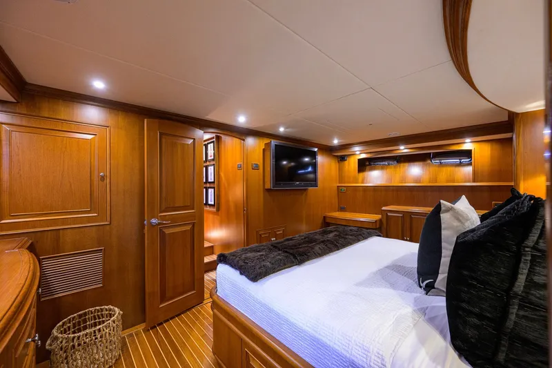 Slide: The Image of Luxurious wooden interior of 2008 Grand Banks 72 Aleutian RP yacht bedroom. - 16