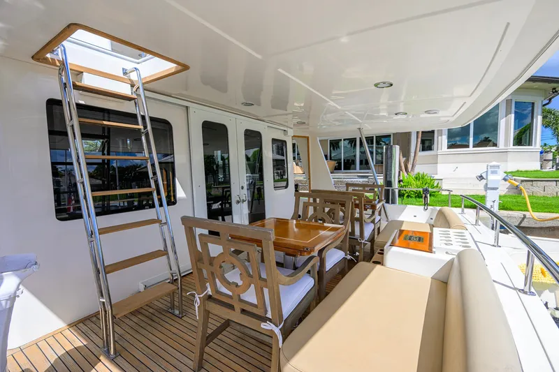 Slide: The Image of Luxurious 2008 Grand Banks 72 Aleutian RP yacht deck with seating and ladder. - 32