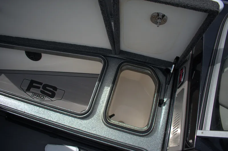 Slide: The Image of 2023 Ranger 622FS Pro boat storage compartments with open lids and FS Pro branding. - 14