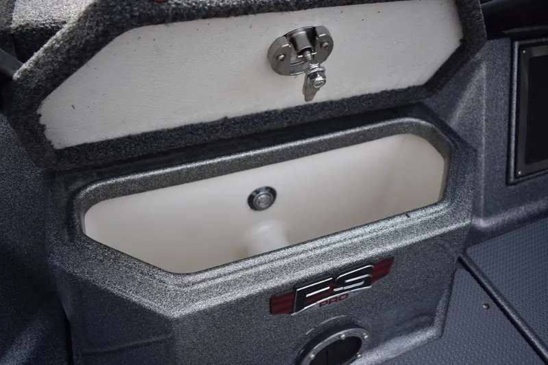 Slide: The Image of 2023 Ranger 622FS Pro boat storage compartment with secure latch and FS Pro branding. - 15