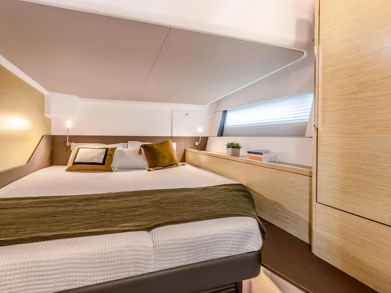 Slide: The Image of Luxurious bedroom interior of 2024 Hanse 510 yacht with modern design and cozy bedding. - 15