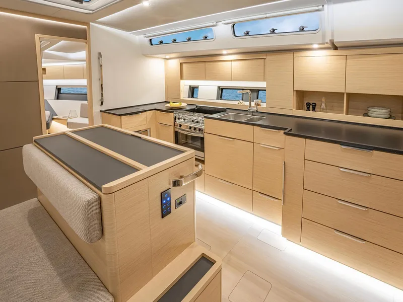 Slide: The Image of Modern kitchen interior of 2024 Hanse 510 yacht with sleek wooden cabinetry. - 10
