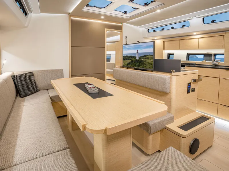 Slide: The Image of Luxurious interior of the 2024 Hanse 510 yacht with modern furnishings and ample natural light. - 9