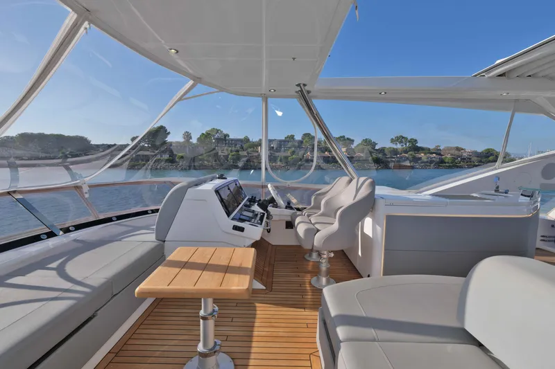 Slide: The Image of Luxurious 2018 Sunseeker 76 Yacht helm with panoramic views and elegant seating. - 40