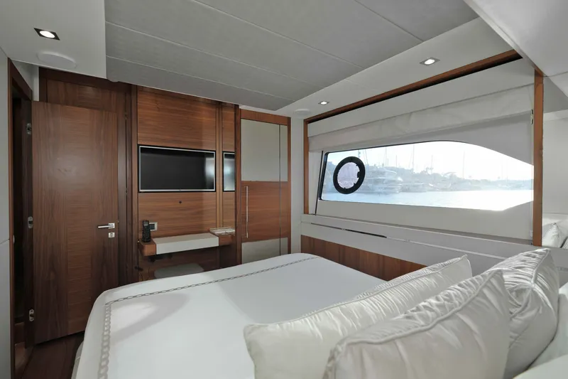 Slide: The Image of Luxurious interior of 2018 Sunseeker 76 Yacht with elegant wood finishes and large window view. - 51