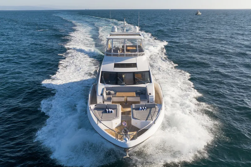 Slide: The Image of 2018 Sunseeker 76 Yacht cruising on open sea, showcasing luxury and performance. - 6
