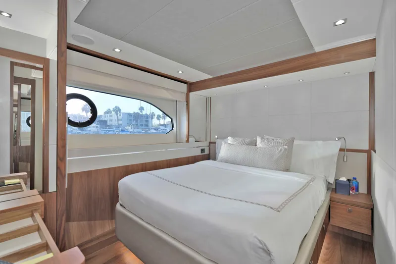 Slide: The Image of Luxurious bedroom interior of 2018 Sunseeker 76 Yacht with elegant wood finishes and large window. - 50