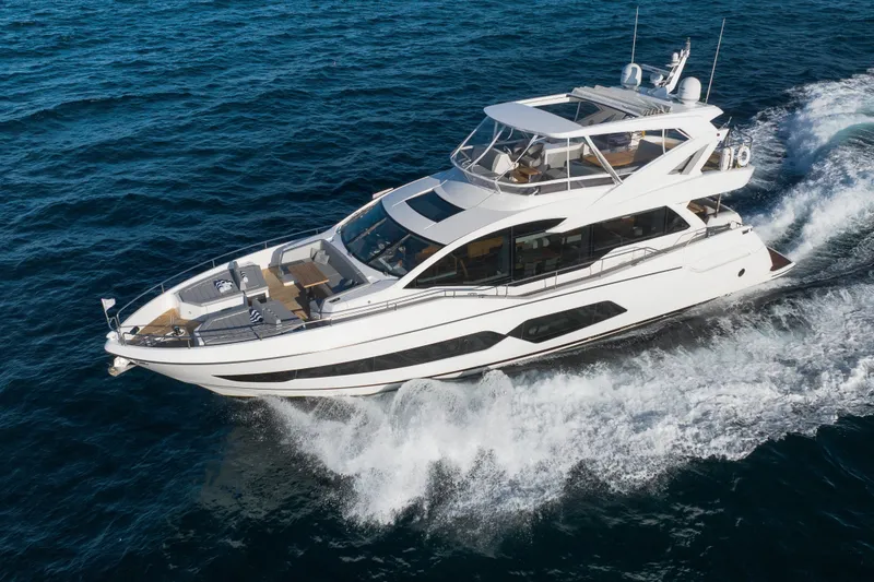 The Image of Luxurious 2018 Sunseeker 76 Yacht cruising on open sea, showcasing sleek design and elegance. - 0