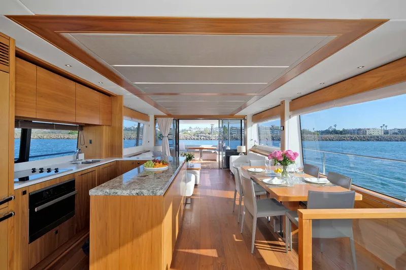 Slide: The Image of Luxurious interior of 2018 Sunseeker 76 Yacht with modern kitchen and dining area. - 15