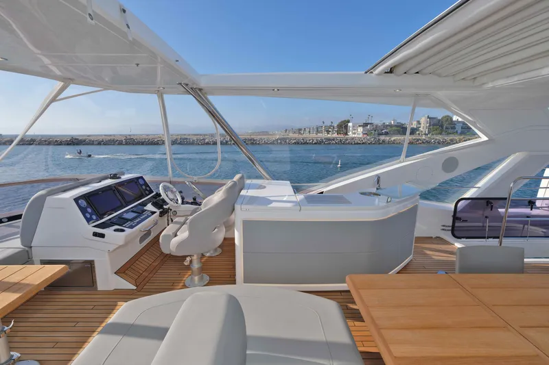 Slide: The Image of Luxurious 2018 Sunseeker 76 Yacht helm with ocean view and modern amenities. - 45