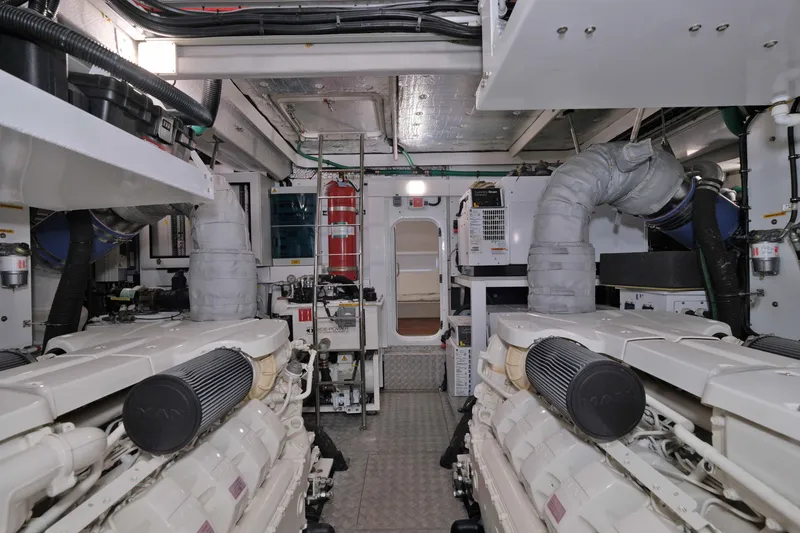 Slide: The Image of Engine room of a 2018 Sunseeker 76 Yacht, showcasing dual engines and mechanical systems. - 84