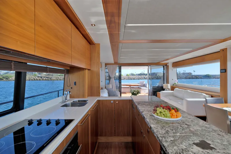 Slide: The Image of Luxurious interior of 2018 Sunseeker 76 Yacht with modern kitchen and ocean view. - 13