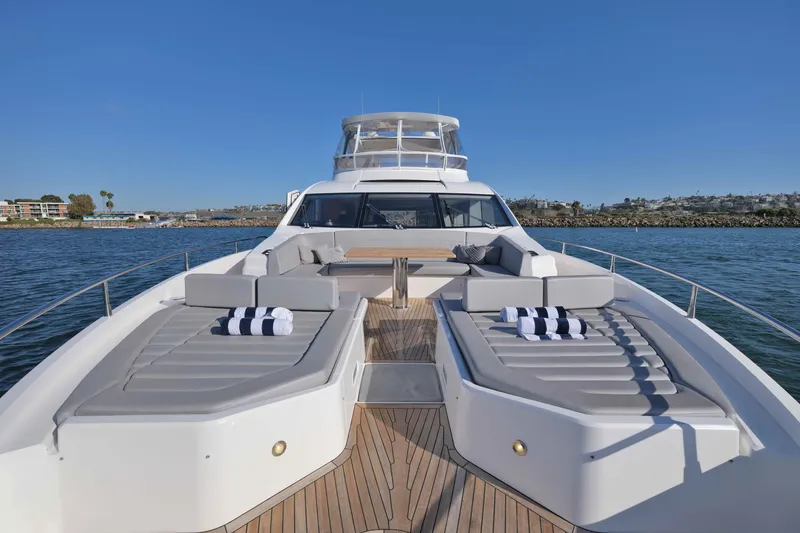 Slide: The Image of Luxurious 2018 Sunseeker 76 Yacht with spacious deck and elegant seating on open water. - 34