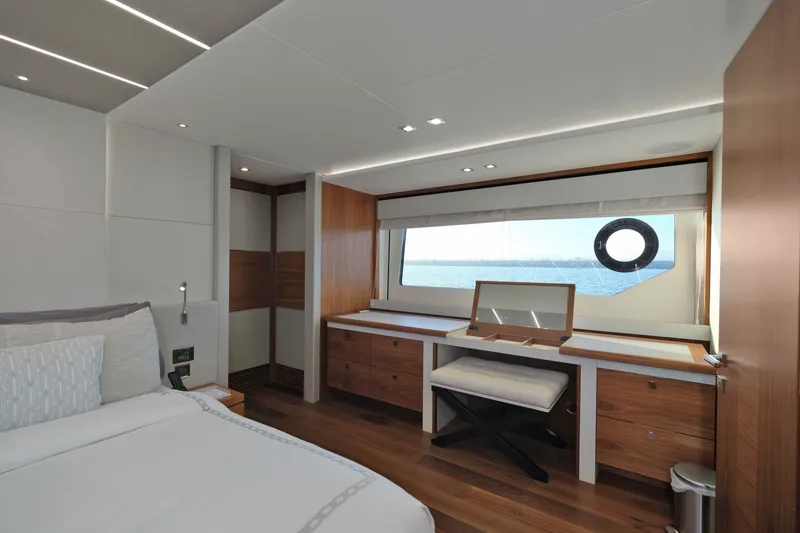 Slide: The Image of Luxurious interior of 2018 Sunseeker 76 Yacht with elegant wood finishes and ocean view. - 77