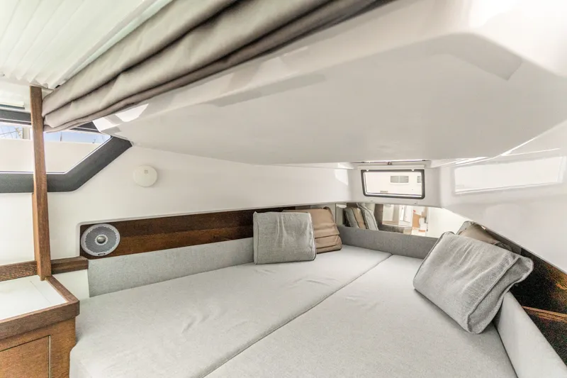 Slide: The Image of Cozy interior cabin of 2019 Axopar 37, featuring comfortable bedding and modern design. - 13