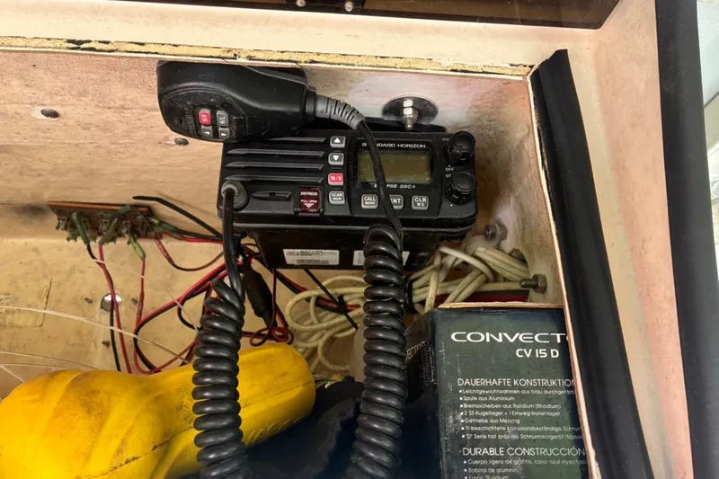 Slide: The Image of VHF radio setup on a 2000 Cape Horn 27XS boat, with wiring and equipment. - 39