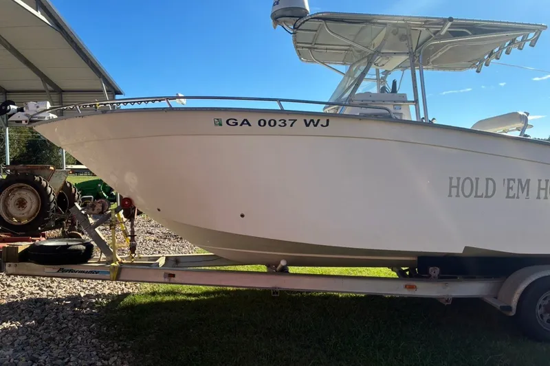 Slide: The Image of Cape Horn 27XS boat from 2000 on trailer, side view with registration number visible. - 4