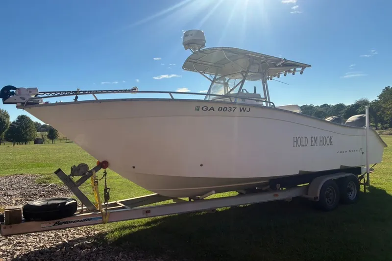 Slide: The Image of Cape Horn 27XS 2000 boat on trailer, sunny day, grassy background. - 3