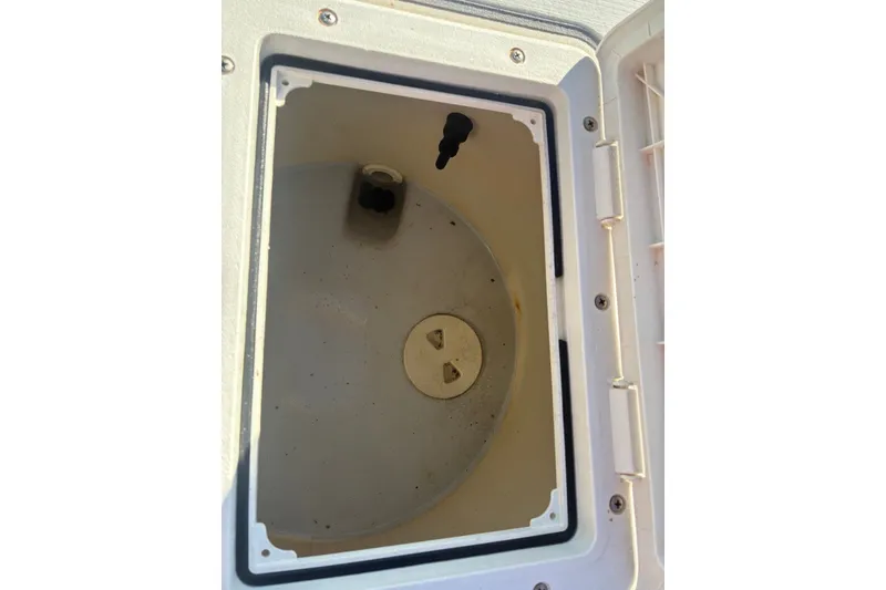 Slide: The Image of Open storage compartment on a 2000 Cape Horn 27XS boat. - 58