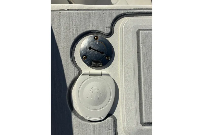 Slide: The Image of Boat deck detail of a 2000 Cape Horn 27XS, featuring a water access point. - 47