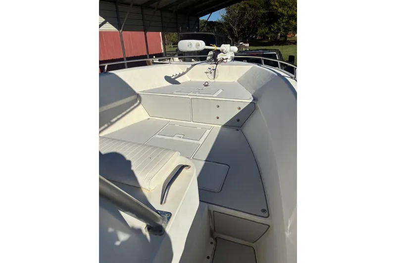 Slide: The Image of 2000 Cape Horn 27XS boat interior with seating and storage compartments. - 29