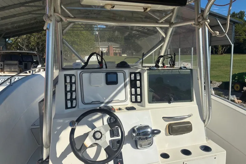Slide: The Image of Cockpit view of a 2000 Cape Horn 27XS boat with steering wheel and controls. - 35