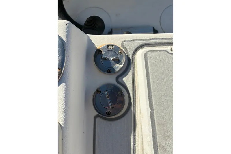 Slide: The Image of Fuel and water caps on a 2000 Cape Horn 27XS boat deck. - 48